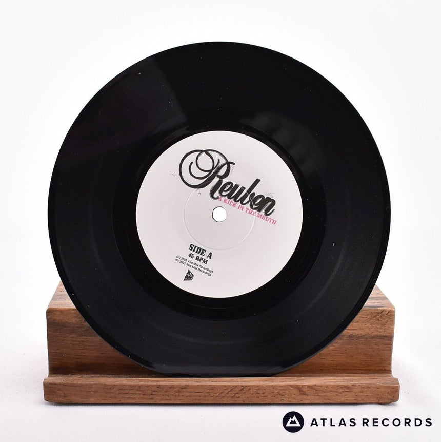 Reuben - A Kick In The Mouth - 7" Vinyl Record - NM/NM