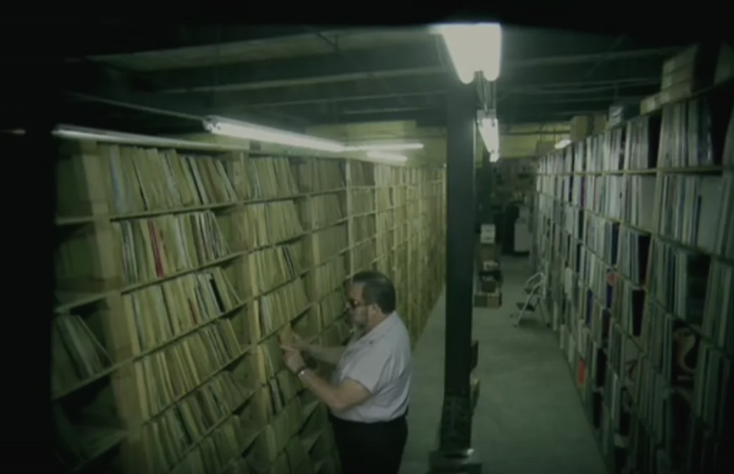 Paul Mawhinney browsing his record archive