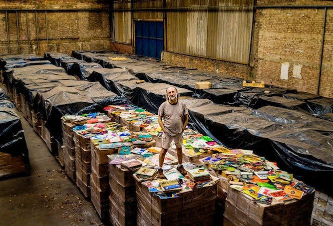 Zero Freitas standing in a huge warehouse full of his records