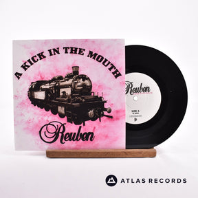 Reuben A Kick In The Mouth 7" Vinyl Record - Front Cover & Record